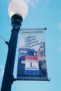 A light post in Franklin Grove sports a new Lincoln Highway sign. 